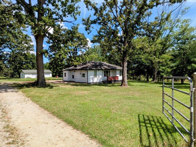 13802 E State Highway 76, Taneyville, MO 65759 - view of green lawn featuring dirt driveway