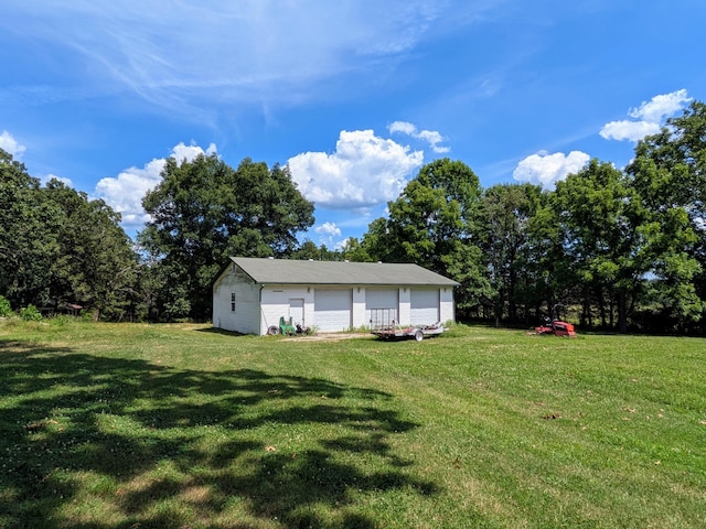 13802 E State Highway 76, Taneyville, MO 65759 - view of green lawn with a garage