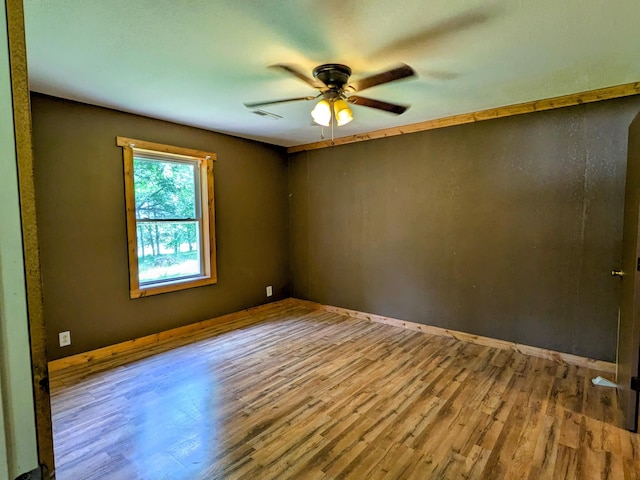 13802 E State Highway 76, Taneyville, MO 65759 - empty room with wood finished floors and a ceiling fan