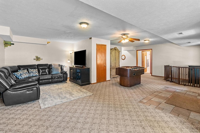 2602 S 15th Ave, Ozark, MO 65721 - living area with carpet floors, a ceiling fan, and a textured ceiling