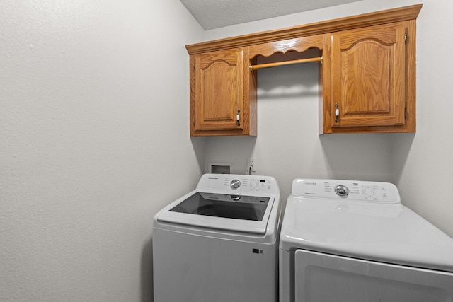 2602 S 15th Ave, Ozark, MO 65721 - washroom with cabinet space and separate washer and dryer