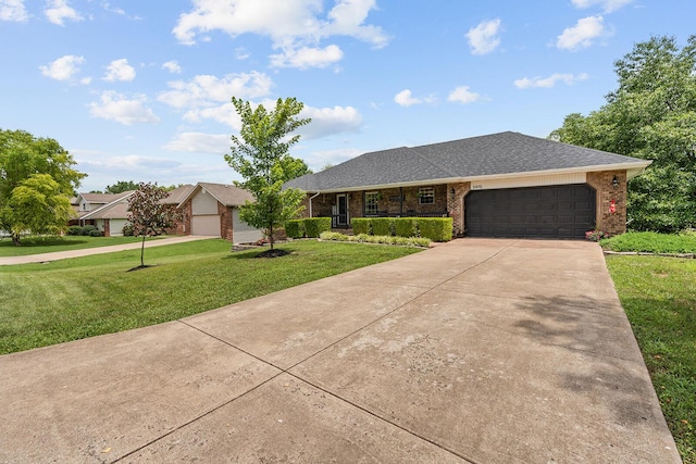 2602 S 15th Ave, Ozark, MO 65721 - ranch-style house with a front yard, brick siding, concrete driveway, a garage, and roof with shingles