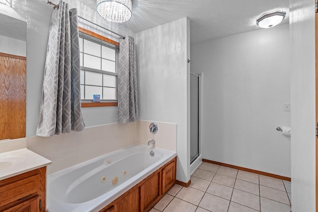2602 S 15th Ave, Ozark, MO 65721 - full bathroom with a shower stall, a tub with jets, tile patterned floors, vanity, and a chandelier