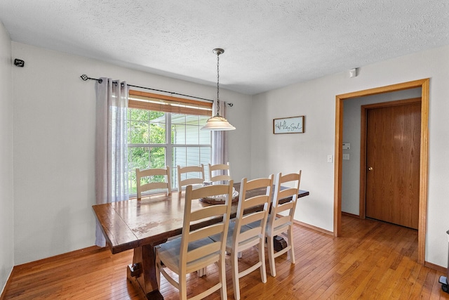 2602 S 15th Ave, Ozark, MO 65721 - dining space with light wood-type flooring and a textured ceiling