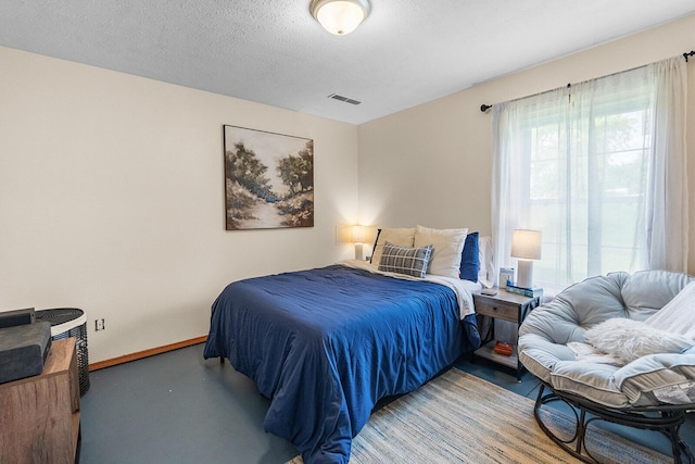 2602 S 15th Ave, Ozark, MO 65721 - bedroom with a textured ceiling and finished concrete floors