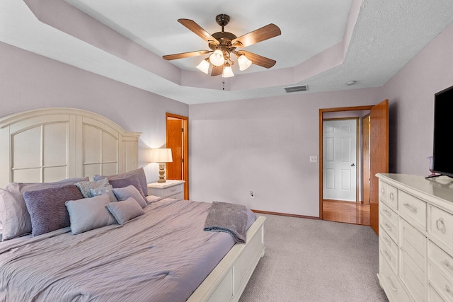 2602 S 15th Ave, Ozark, MO 65721 - bedroom featuring light carpet, a raised ceiling, and ceiling fan