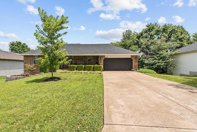 2602 S 15th Ave, Ozark, MO 65721 - ranch-style home with driveway, an attached garage, a front yard, and brick siding