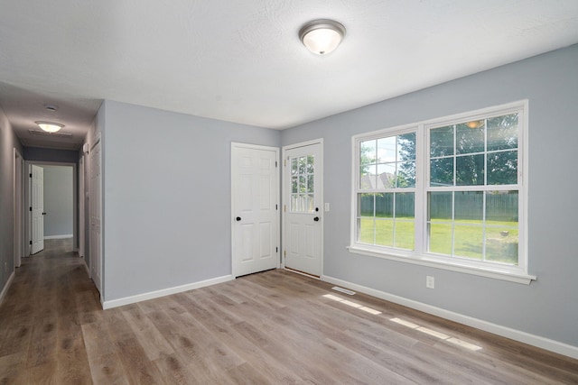 1020 Gretchen St, Nixa, MO 65714 - entryway featuring baseboards and wood finished floors