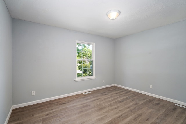 1020 Gretchen St, Nixa, MO 65714 - unfurnished room with dark wood-type flooring and baseboards