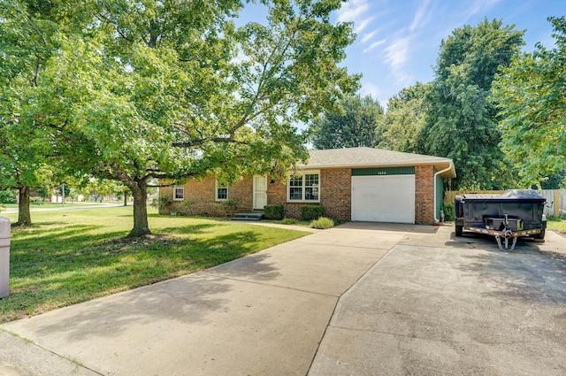 1020 Gretchen St, Nixa, MO 65714 - view of front facade with an attached garage, concrete driveway, a front yard, and brick siding