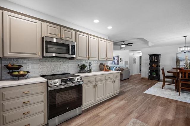 620 E Summit St, Bolivar, MO 65613 - kitchen featuring stainless steel appliances, a ceiling fan, decorative backsplash, light wood-style flooring, and recessed lighting