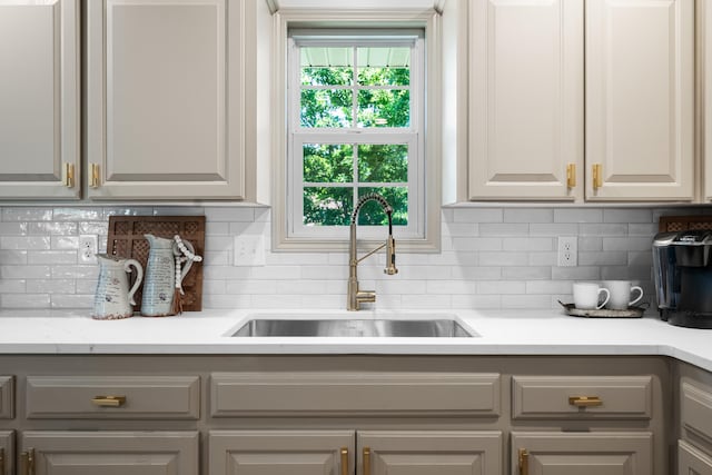 620 E Summit St, Bolivar, MO 65613 - kitchen featuring backsplash and gray cabinetry