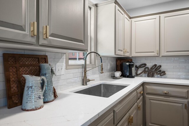 620 E Summit St, Bolivar, MO 65613 - kitchen with gray cabinetry and tasteful backsplash