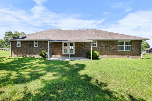 620 E Summit St, Bolivar, MO 65613 - back of property featuring crawl space, a patio, a yard, brick siding, and roof with shingles