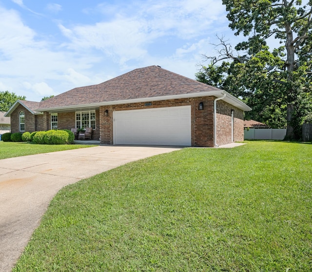 620 E Summit St, Bolivar, MO 65613 - ranch-style home featuring driveway, an attached garage, brick siding, and roof with shingles