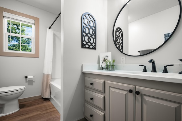 620 E Summit St, Bolivar, MO 65613 - bathroom with vanity, wood finished floors, and shower / bath combination with curtain
