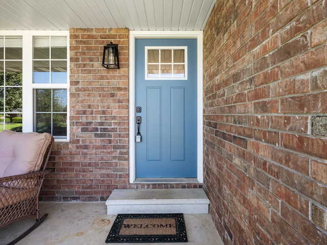620 E Summit St, Bolivar, MO 65613 - view of exterior entry with brick siding and covered porch