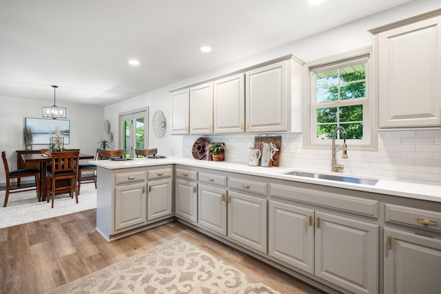 620 E Summit St, Bolivar, MO 65613 - kitchen with gray cabinets, healthy amount of natural light, backsplash, and recessed lighting