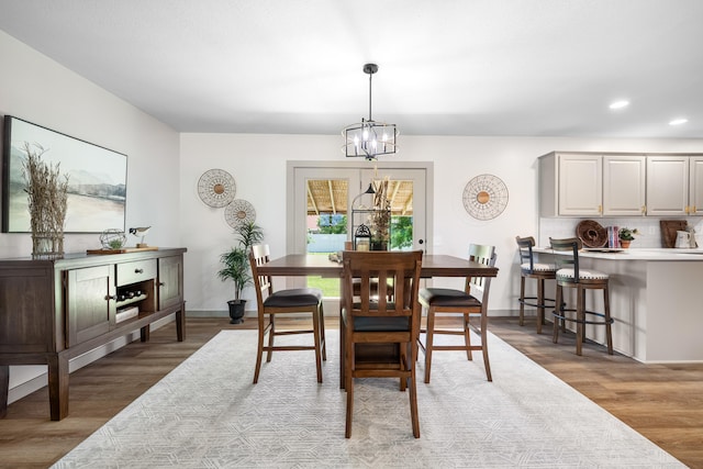 620 E Summit St, Bolivar, MO 65613 - dining room with a chandelier, wood finished floors, and recessed lighting