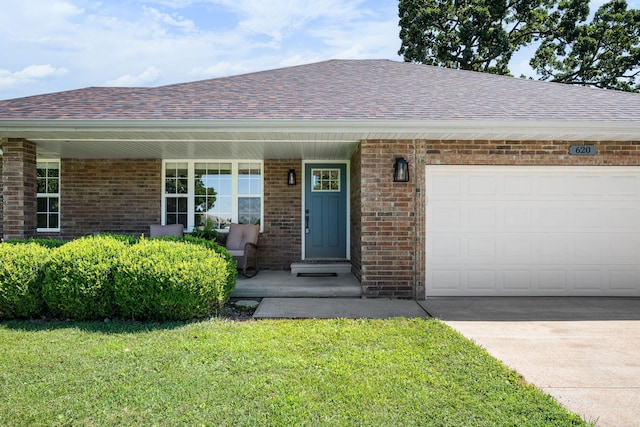 620 E Summit St, Bolivar, MO 65613 - view of front of home featuring an attached garage, a shingled roof, a front lawn, a porch, and brick siding