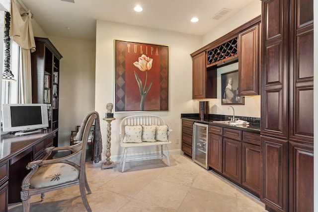 10 Patterson Ave, Branson, MO 65616 - kitchen featuring dark countertops, beverage cooler, recessed lighting, light tile patterned floors, and an office area