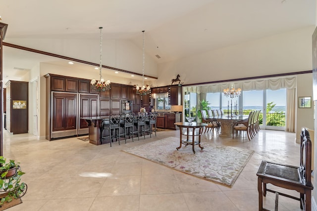 10 Patterson Ave, Branson, MO 65616 - dining room with a chandelier, high vaulted ceiling, and light tile patterned floors