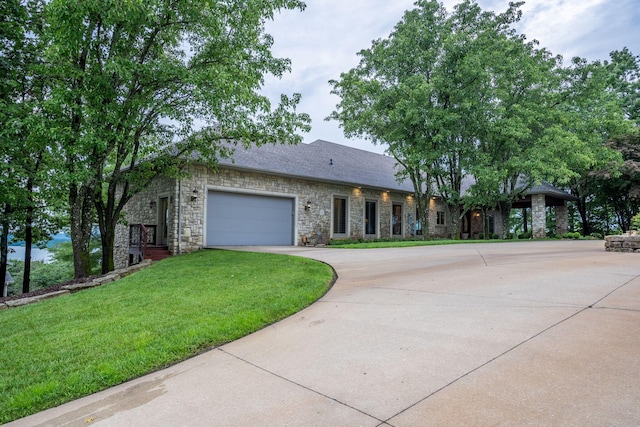 10 Patterson Ave, Branson, MO 65616 - single story home featuring stone siding, concrete driveway, a front lawn, and an attached garage