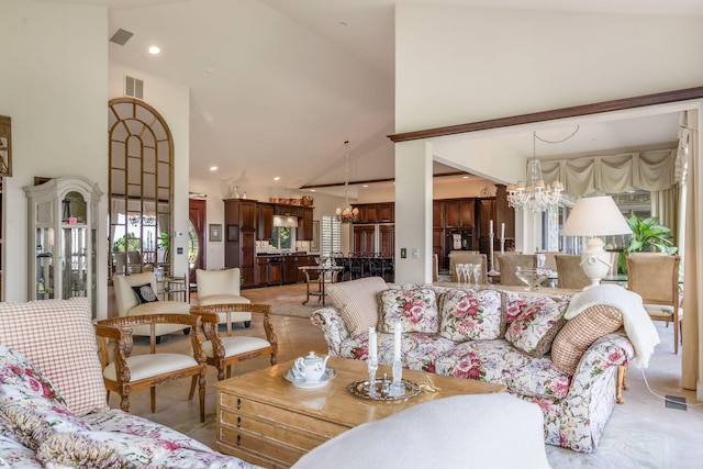 10 Patterson Ave, Branson, MO 65616 - living area with high vaulted ceiling, a chandelier, and recessed lighting