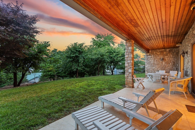 10 Patterson Ave, Branson, MO 65616 - patio terrace at dusk with a patio and outdoor dining area