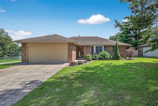 2812 E Linwood St, Springfield, MO 65804 - ranch-style house with a garage, concrete driveway, brick siding, and roof with shingles