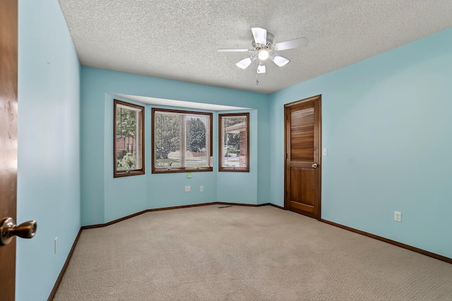 2812 E Linwood St, Springfield, MO 65804 - empty room featuring light carpet, a textured ceiling, and a ceiling fan