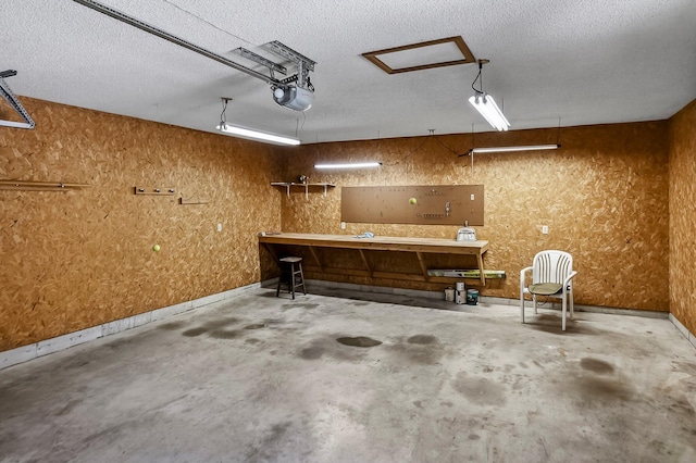 2812 E Linwood St, Springfield, MO 65804 - garage featuring a workshop area and a garage door opener