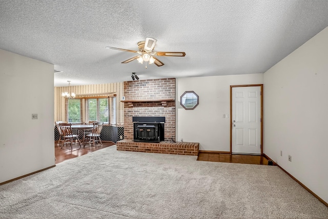2812 E Linwood St, Springfield, MO 65804 - living room with a ceiling fan, carpet, a textured ceiling, and a chandelier