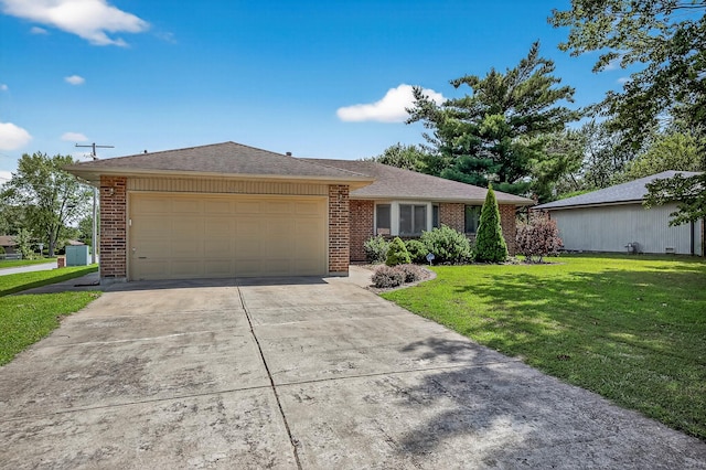 2812 E Linwood St, Springfield, MO 65804 - ranch-style home with an attached garage, driveway, brick siding, and a front lawn