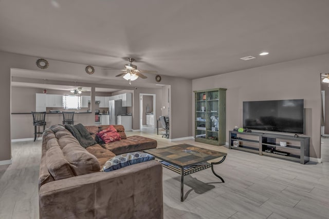 3197 S Grand Ave, Carthage, MO 64836 - living room featuring ceiling fan and light wood-type flooring