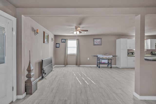 3197 S Grand Ave, Carthage, MO 64836 - living area with a ceiling fan and baseboards