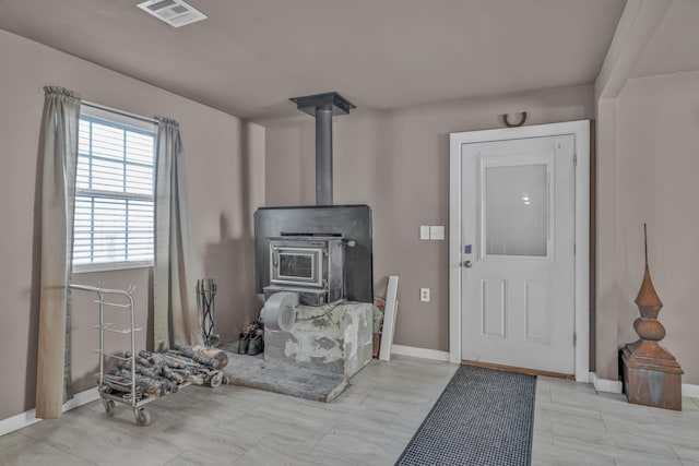3197 S Grand Ave, Carthage, MO 64836 - entrance foyer with a wood stove and baseboards