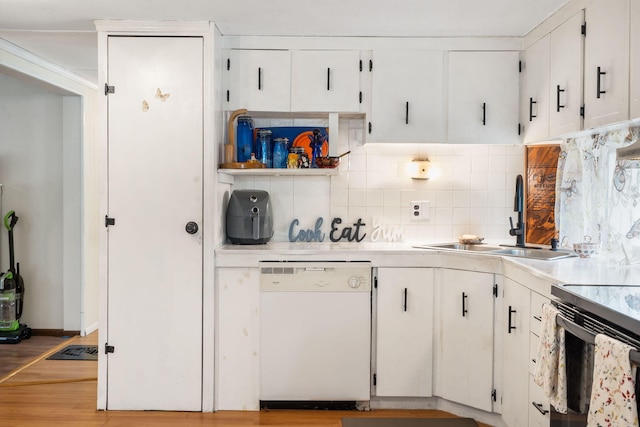 6665 State Highway 173, Cape Fair, MO 65624 - kitchen featuring white dishwasher, tasteful backsplash, light countertops, and white cabinetry