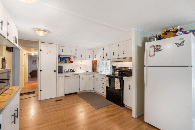 6665 State Highway 173, Cape Fair, MO 65624 - kitchen featuring white appliances, under cabinet range hood, light wood-style floors, and white cabinetry