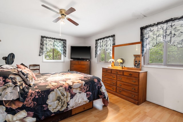 6665 State Highway 173, Cape Fair, MO 65624 - bedroom featuring multiple windows and wood finished floors