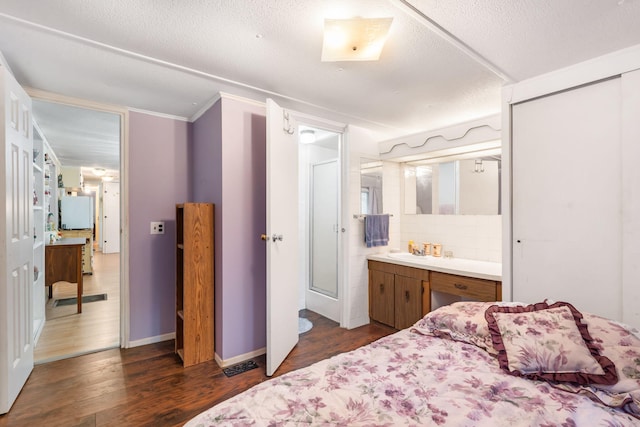 6665 State Highway 173, Cape Fair, MO 65624 - bedroom featuring dark wood-style flooring, connected bathroom, and ornamental molding
