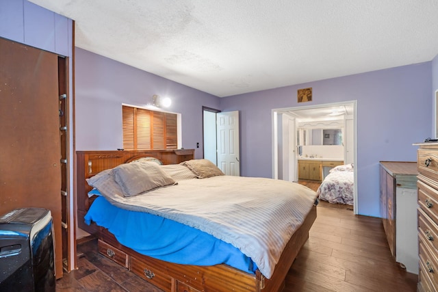 6665 State Highway 173, Cape Fair, MO 65624 - bedroom featuring a textured ceiling, dark wood-style floors, and ensuite bath