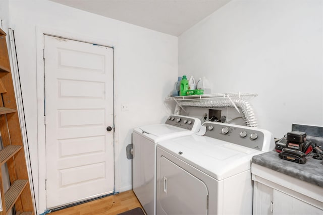 6665 State Highway 173, Cape Fair, MO 65624 - washroom featuring washer and clothes dryer and light wood finished floors
