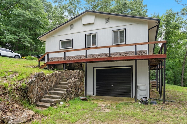 6665 State Highway 173, Cape Fair, MO 65624 - view of front of property featuring a garage, stairs, and stone siding