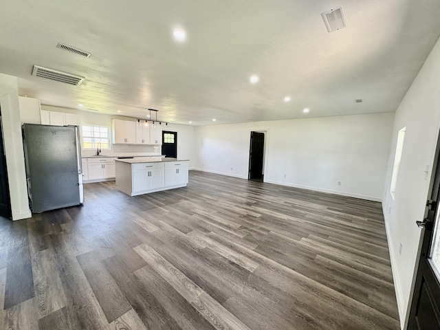 401 E 17th St, Lockwood, MO 65682 - unfurnished living room with dark wood-type flooring and recessed lighting