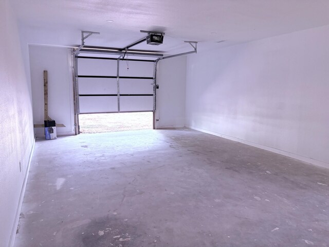 401 E 17th St, Lockwood, MO 65682 - garage featuring a garage door opener
