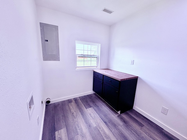 401 E 17th St, Lockwood, MO 65682 - laundry room featuring electric panel, cabinet space, electric dryer hookup, dark wood finished floors, and hookup for a washing machine