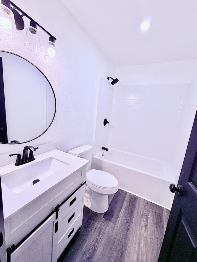 401 E 17th St, Lockwood, MO 65682 - full bathroom featuring wood finished floors, vanity, and shower / tub combination