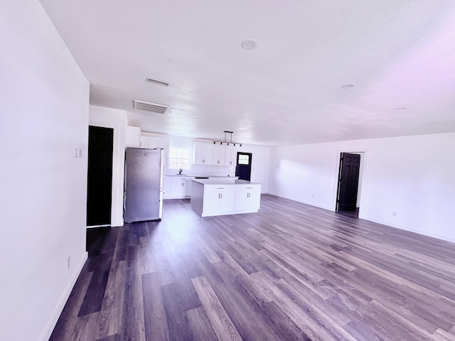 401 E 17th St, Lockwood, MO 65682 - unfurnished living room with dark wood finished floors