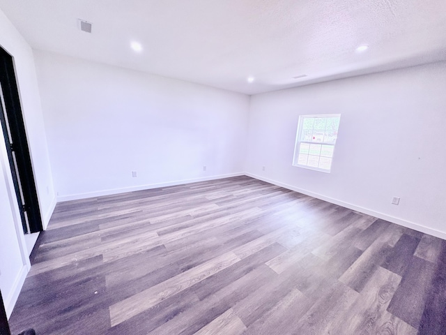 401 E 17th St, Lockwood, MO 65682 - empty room featuring wood finished floors and recessed lighting